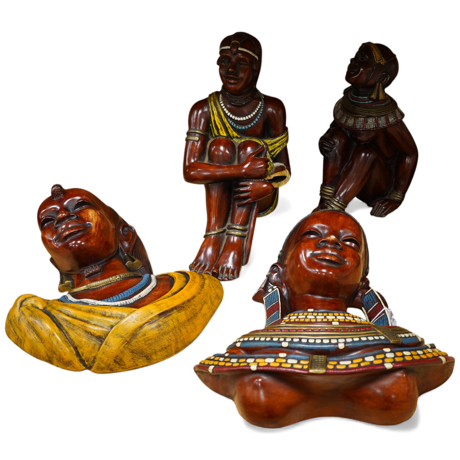 Four Kenyan faux wood figures/busts, signed Masai